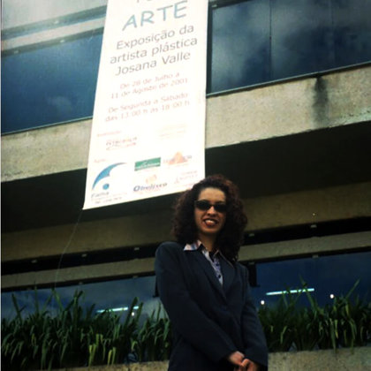 Me with the banner of my exhibition at Raul de Leoni Cultural Center © Josana Valle